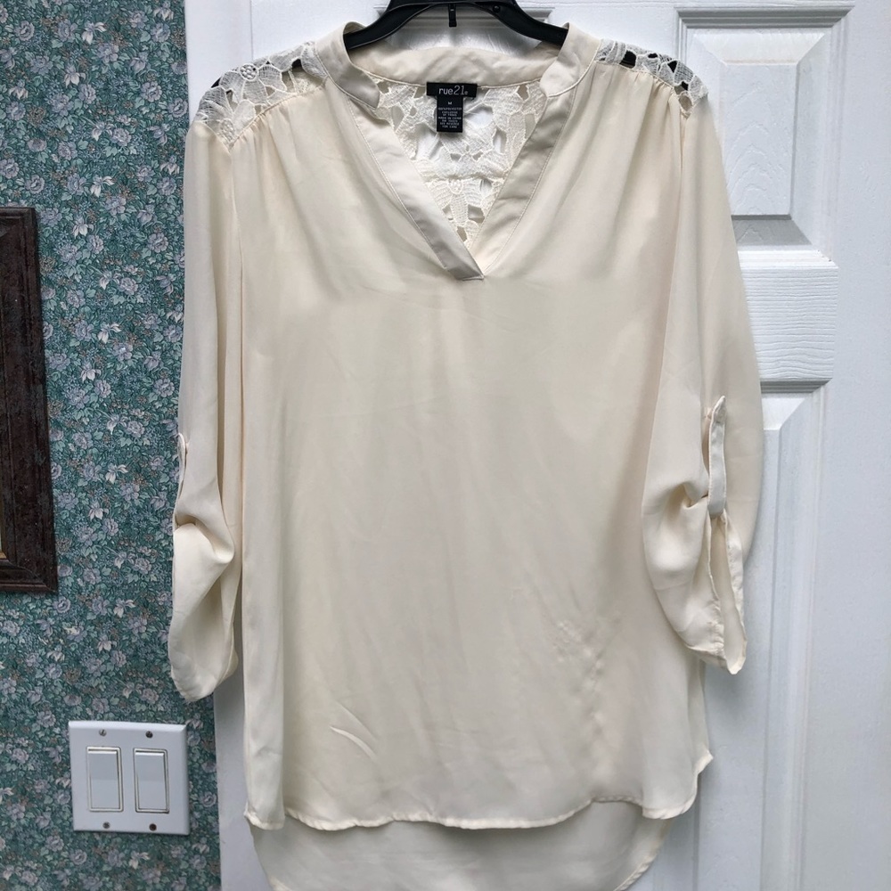 Cream colored blouse with lace detail